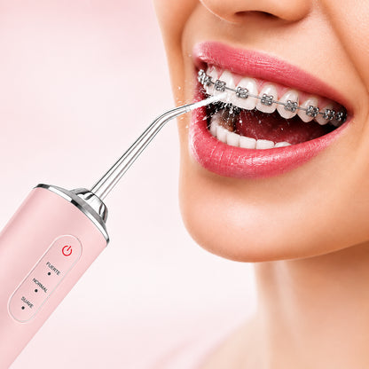 Irrigador dental eléctrico